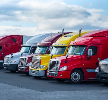 Brightly colored tractor trailer trucks.