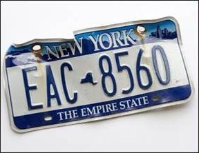 Damaged blue and white empire license plate.