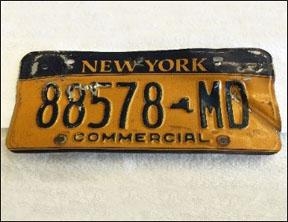 Damaged gold Excelsior plate.