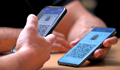 A verifier using a phone to scan a customer's Mobile ID